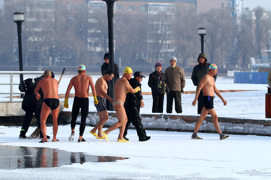 Man saved after falling through frozen lake