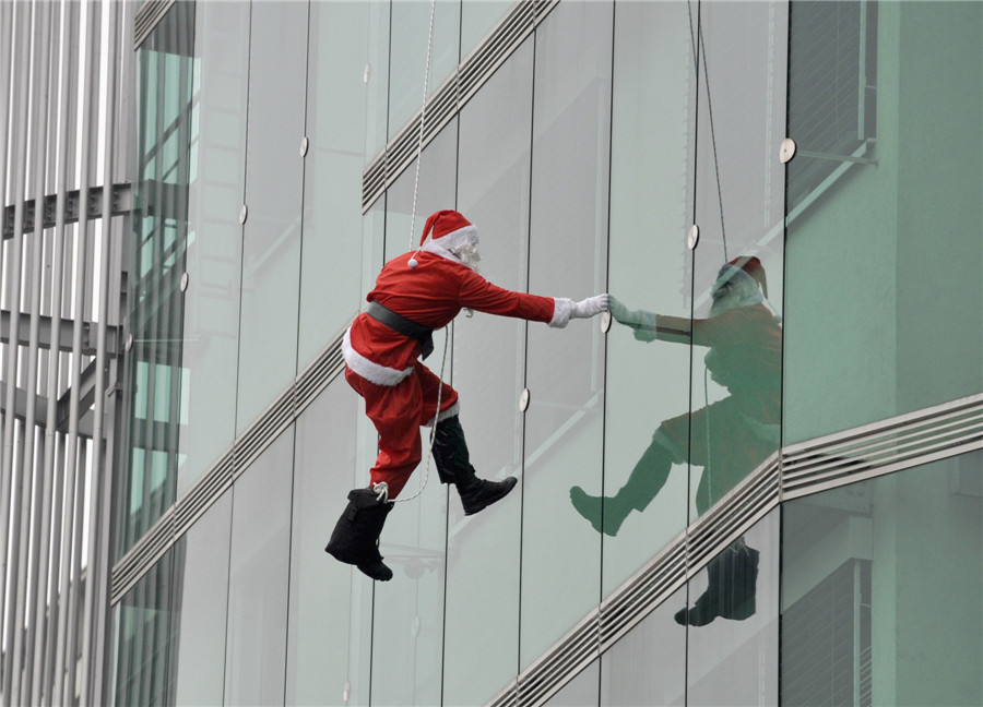 Police dressed as Santa perform for patients