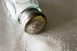 Laborers collect salt at salt pan in the western Indian state of Gujarat