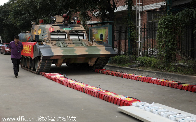 Tank flattens phony fire fighting gear