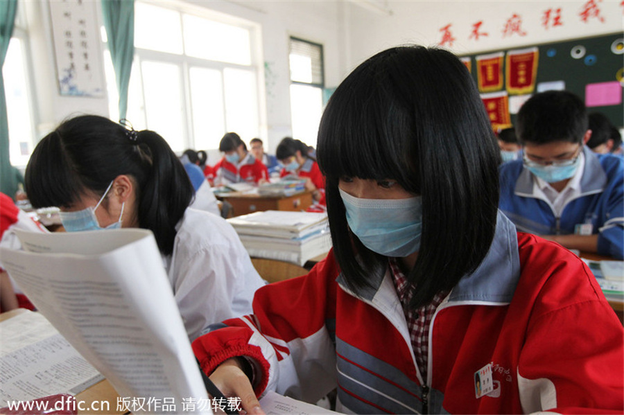 Mask-wearing students protest industrial waste gas