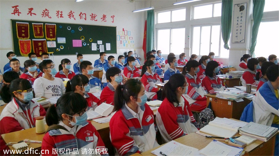 Mask-wearing students protest industrial waste gas