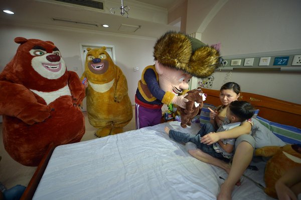 Cartoon characters visit brain tumor boy