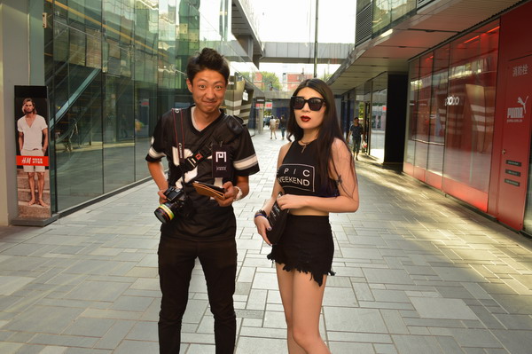 Smile, shove, snap: cameramen behind the street fashion