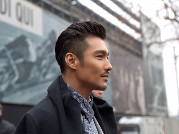 Actor Hu Bing poses at Milan Fashion Week