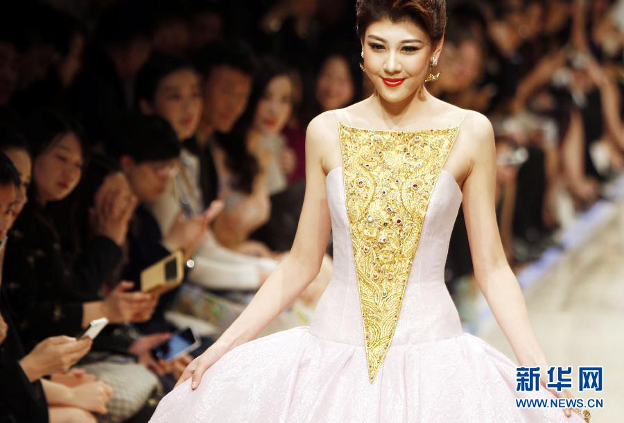 Models present Guo Pei's creations at Shanghai fashion week