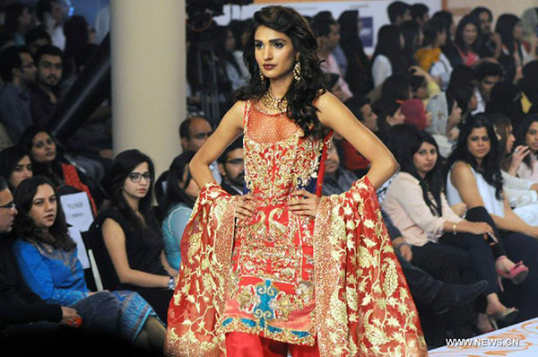 Models present creations at Bridal Couture Fashion Week