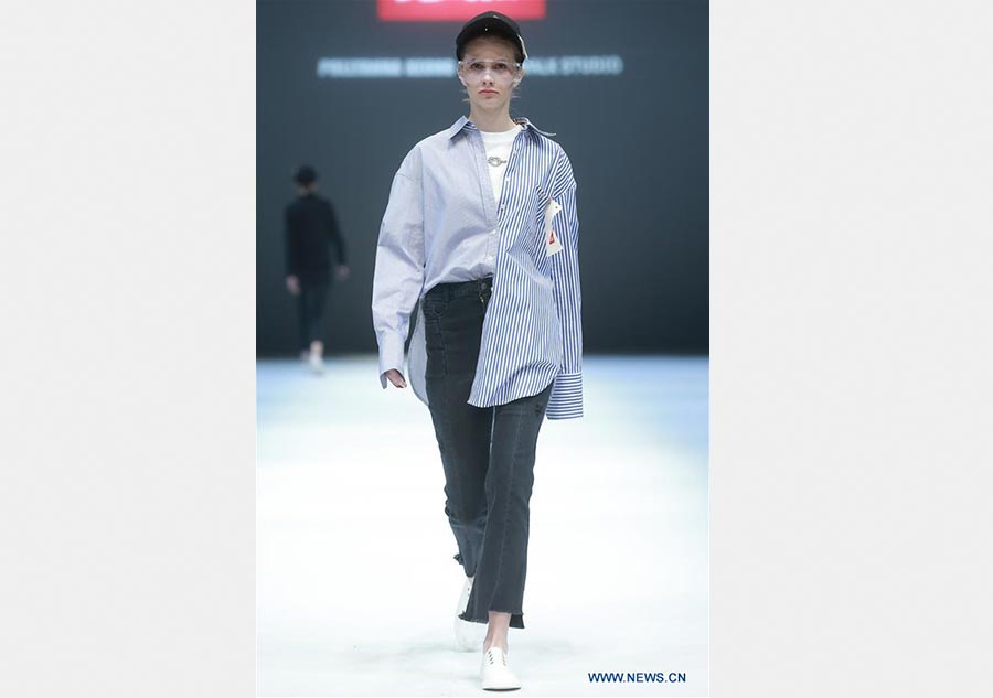 Models present creations of Jiang Yueyin at China Fashion Week