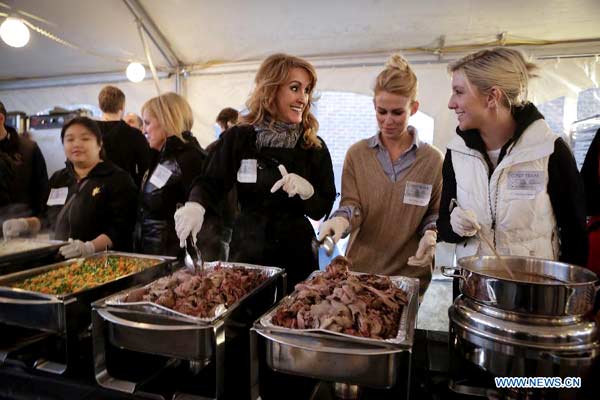 People enjoy free meal at 'Table for 2000' event