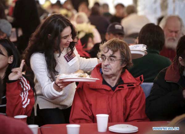 People enjoy free meal at 'Table for 2000' event