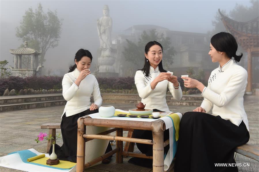 Girls perform tea ceremony at Wuyi Mountain in SE China