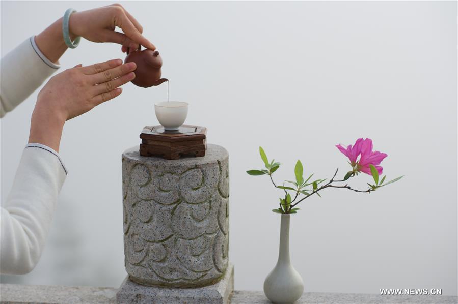 Girls perform tea ceremony at Wuyi Mountain in SE China