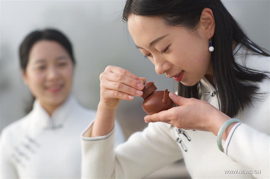 Girls perform tea ceremony at Wuyi Mountain in SE China