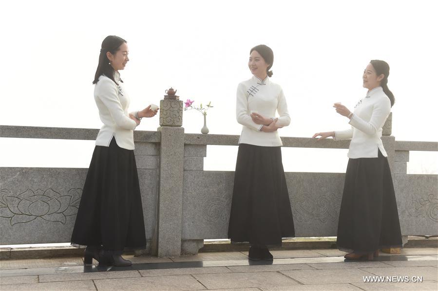 Girls perform tea ceremony at Wuyi Mountain in SE China