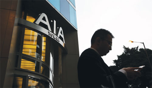 AIA growth cushions 22% profit plunge