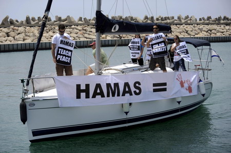 Israeli ships stalk pro-Palestinian aid flotilla