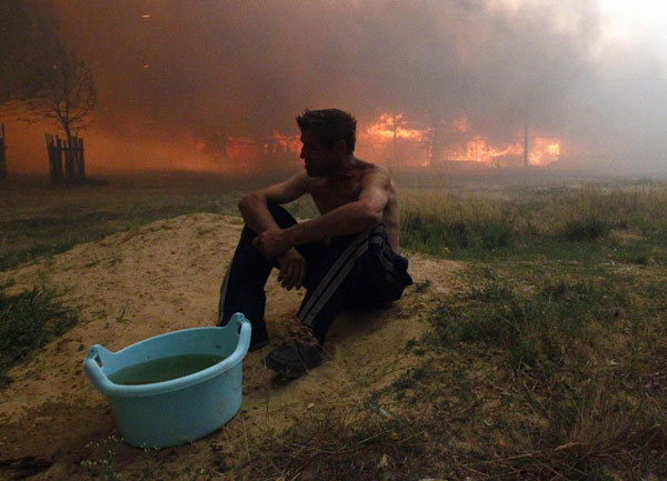 Forest fires spread through Central Russia