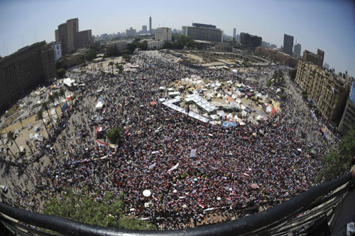 Protesters in Tahrir Square show Morsi the 'red card'