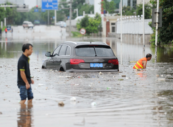 Heavy rains hammer central, southern China