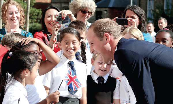 Prince William arrives in China to warm welcome