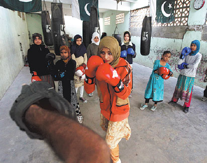 Young female boxers punch through gender barriers