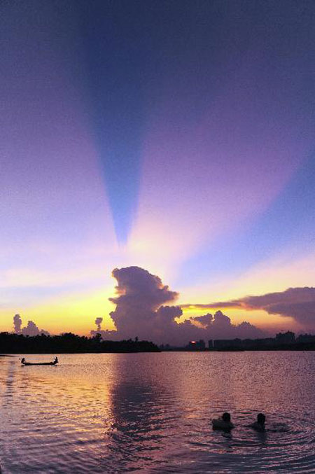 People fish in Wanquan River in Hainan