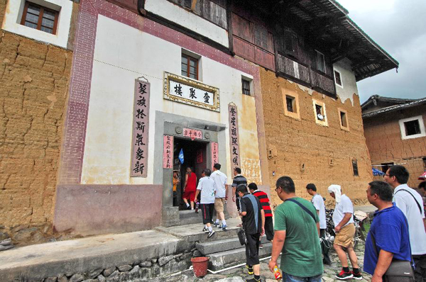 Tourists visit Tulous in Yongding, China's Fujian