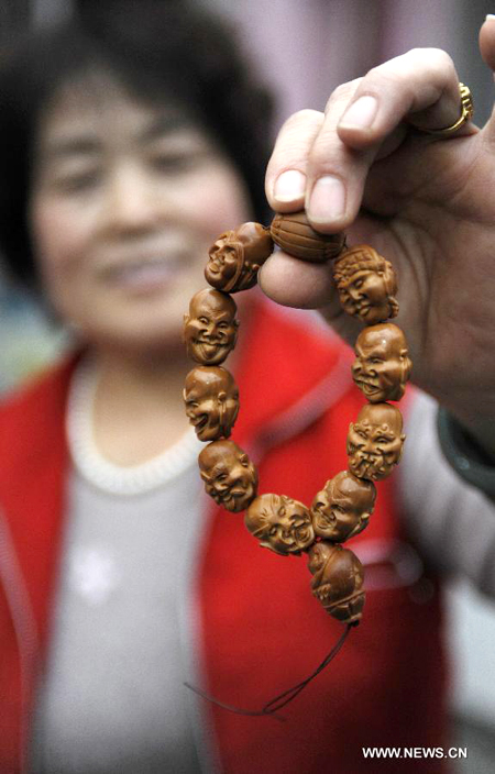 Walnut sculpture village in N China