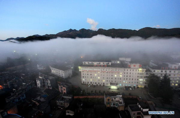 Cloud-blanketed Luoping county in SW China's Yunnan