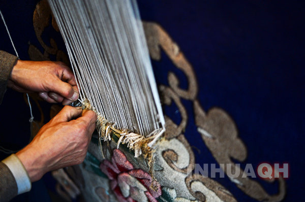 Bearer of Tibetan carpet in Qinghai