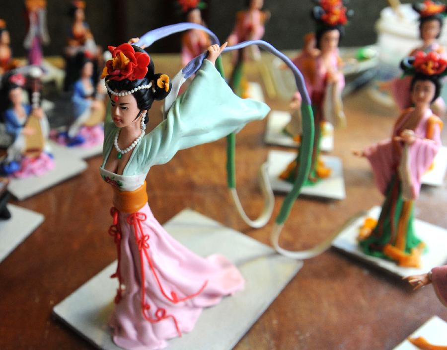 Folk artist makes pretty dough figurines