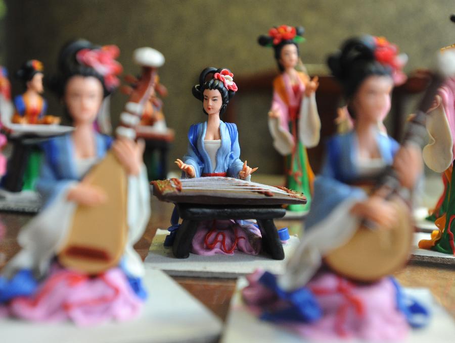 Folk artist makes pretty dough figurines