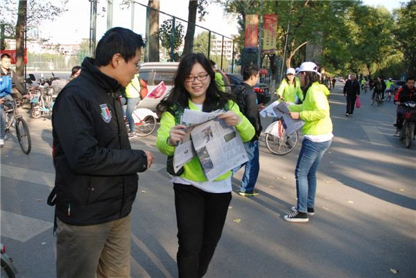 Beijing cycling tour promotes China Daily