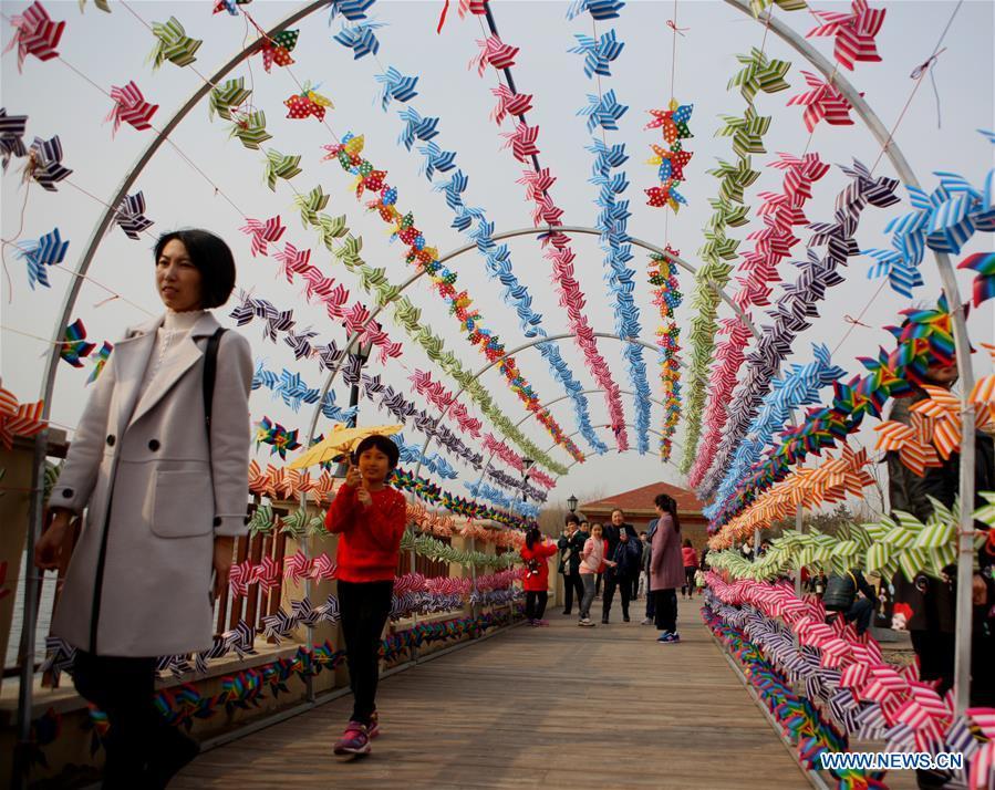 People view pinwheel decoration in NE China's Liaoning