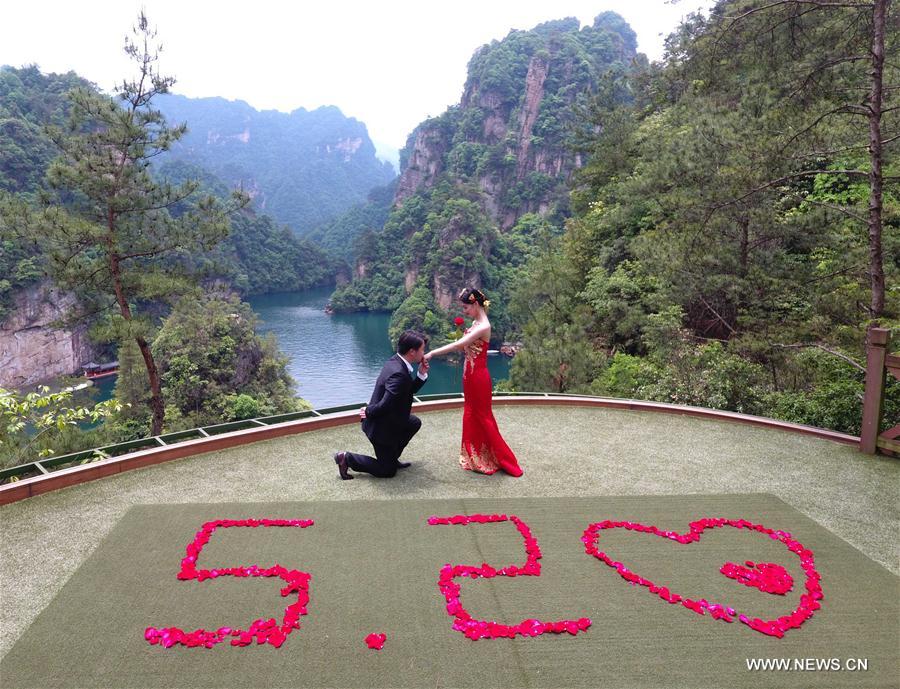 Look of love: Many Chinese couples get married on May 20
