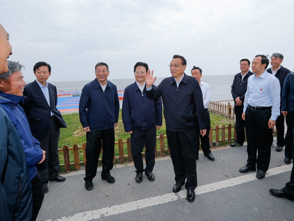 Li inspects Jilin, urges opening-up