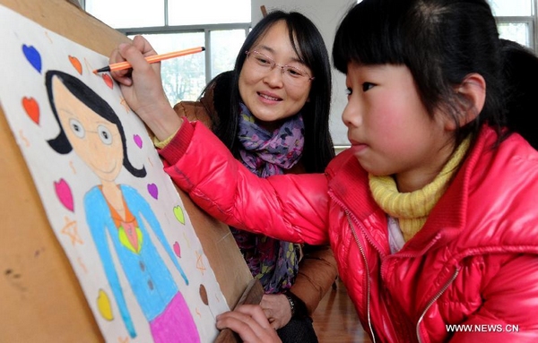 Stay-at-home kids paint portraits for teachers