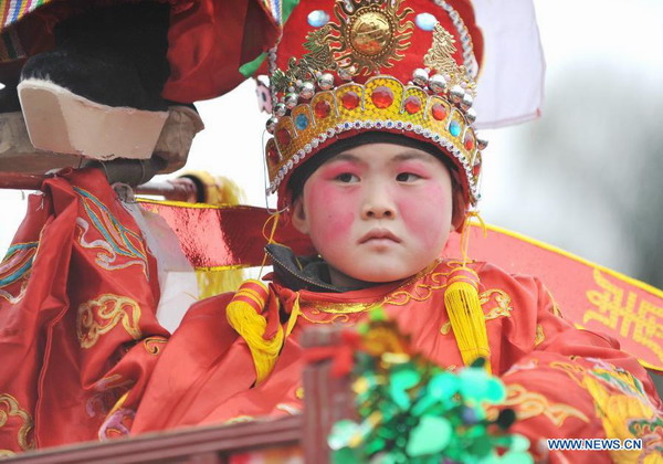 People attend Zougushi Parade in Liancheng