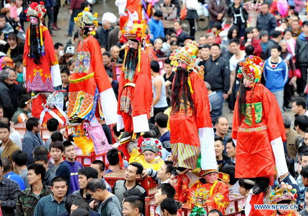 People attend Zougushi Parade in Liancheng