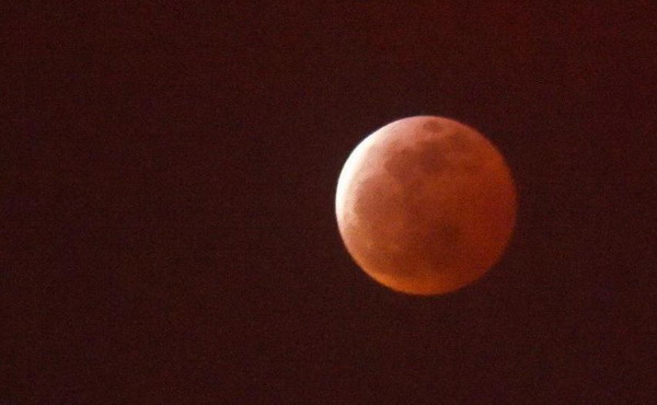 Short lunar eclipse offers a blood red moon