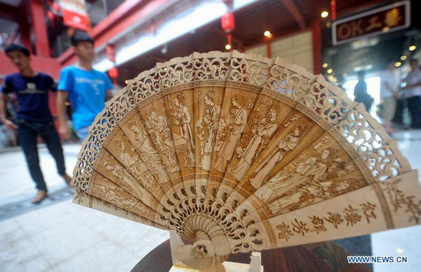 Wood art show held in Xianyou