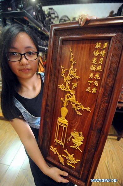 Wood art show held in Xianyou