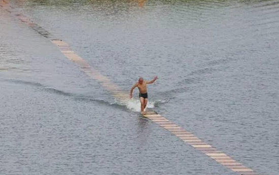 Monk walks on water for a cause