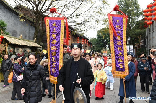 Performers take part in celebration to welcome 'caishen'