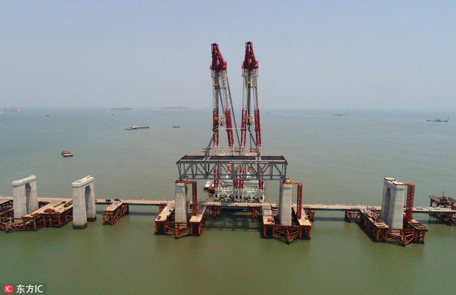 China's first cross-sea rail-road bridge takes shape