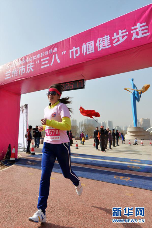 Women enter a walking race on their day