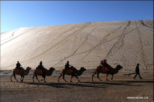 Scenery of crescent spring of Mingsha Hill in Dunhuang