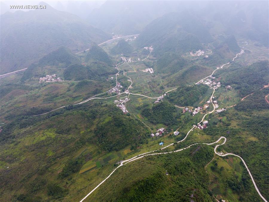 Counstruction of country roads help people to alleviate poverty in Guangxi