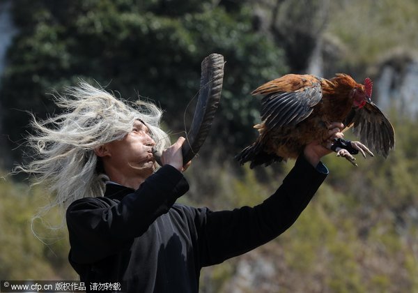 Yi folk artists perform ancient drama