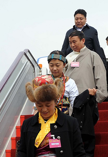 Deputies to 12th NPC arrive in Beijing